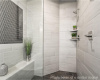 Full bath featuring tiled shower