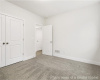 Unfurnished bedroom with carpet, baseboards, and a closet